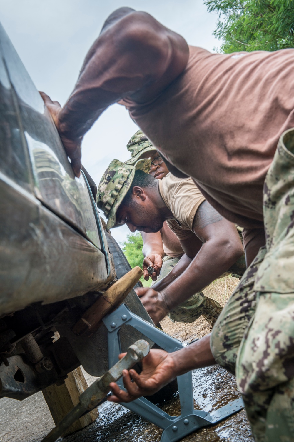 Seabees Change Local's Flat Tire