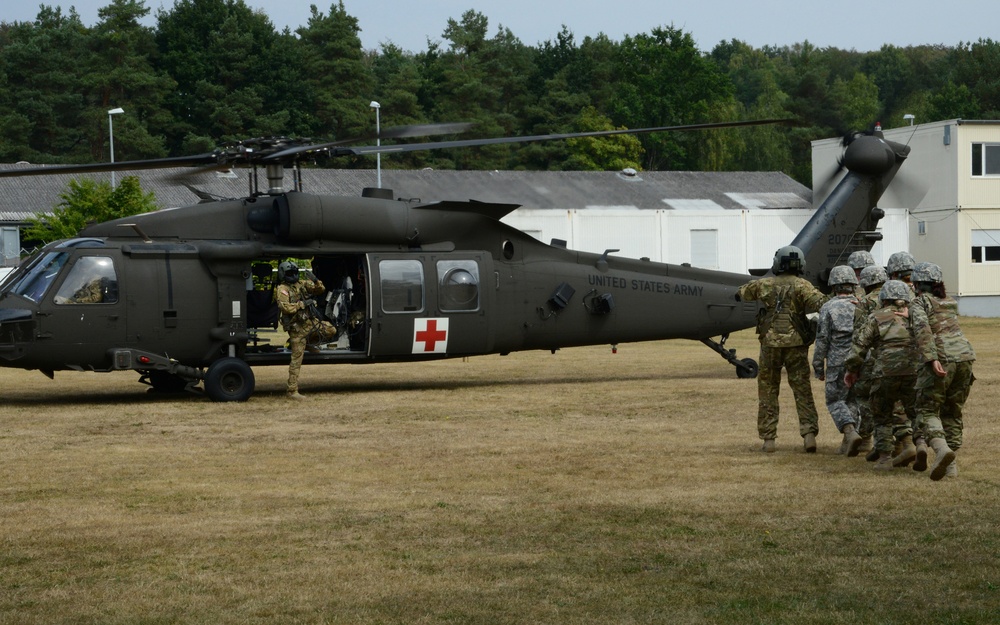 Army Reserve Medical Unit practices MEDEVAC with active duty Blackhawk