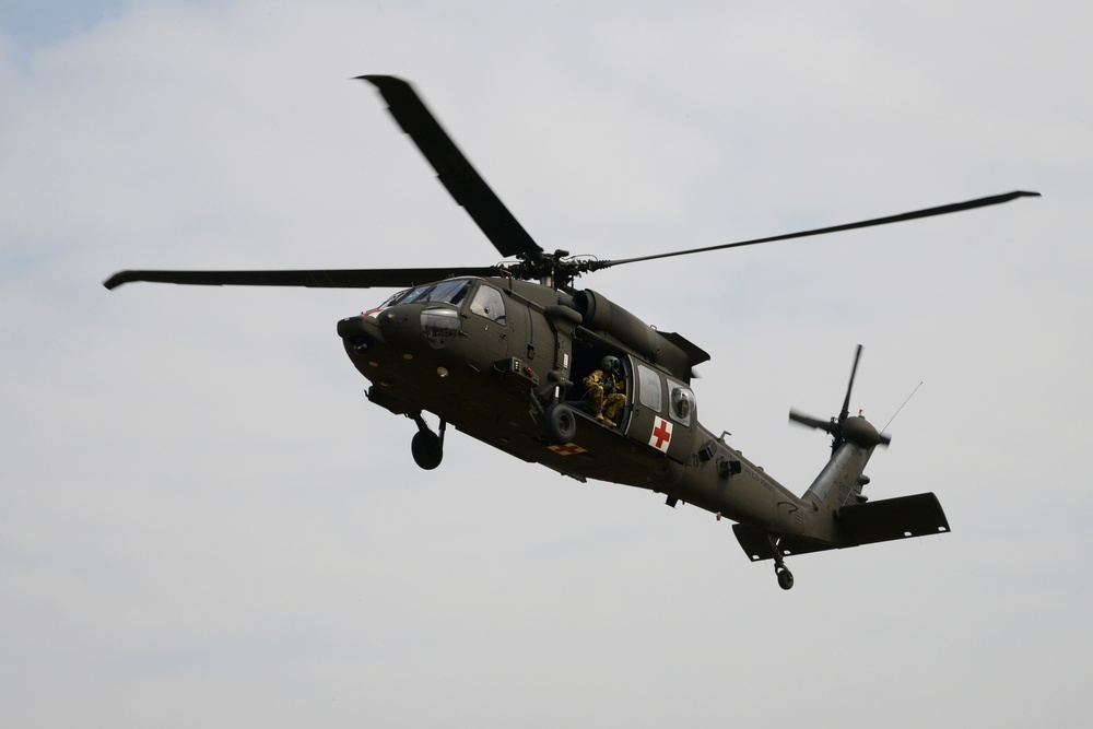 Army Reserve Medical Unit practices MEDEVAC with active duty Blackhawk