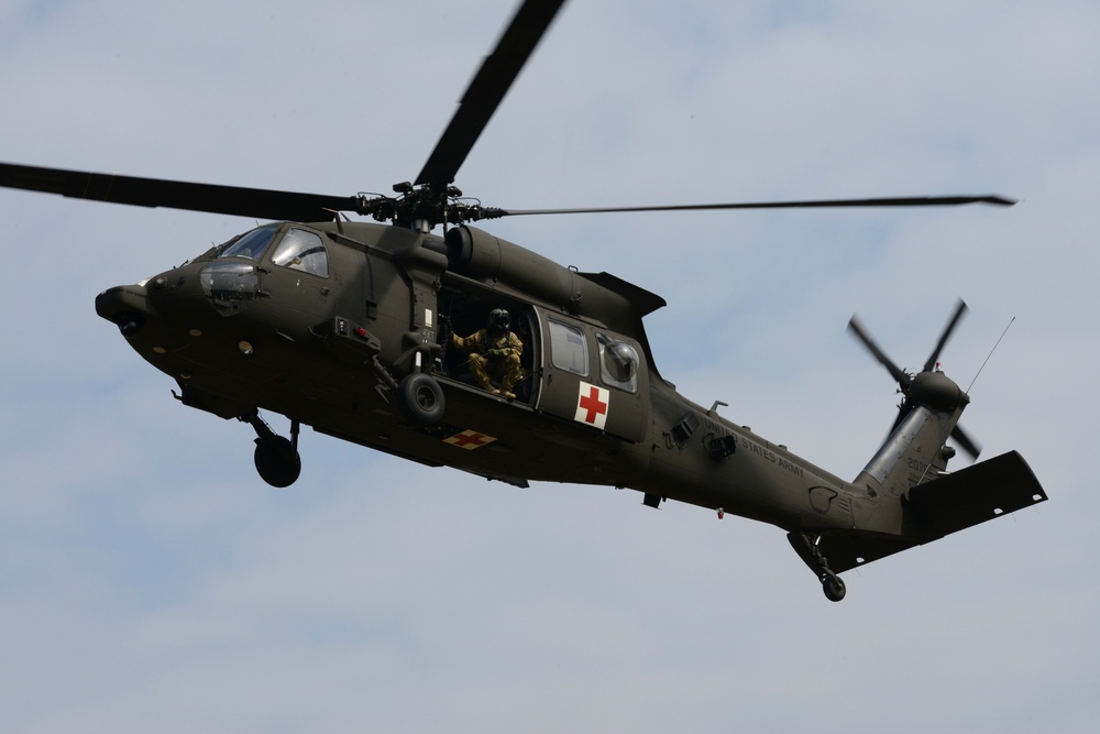 Army Reserve Medical Unit practices MEDEVAC with active duty Blackhawk