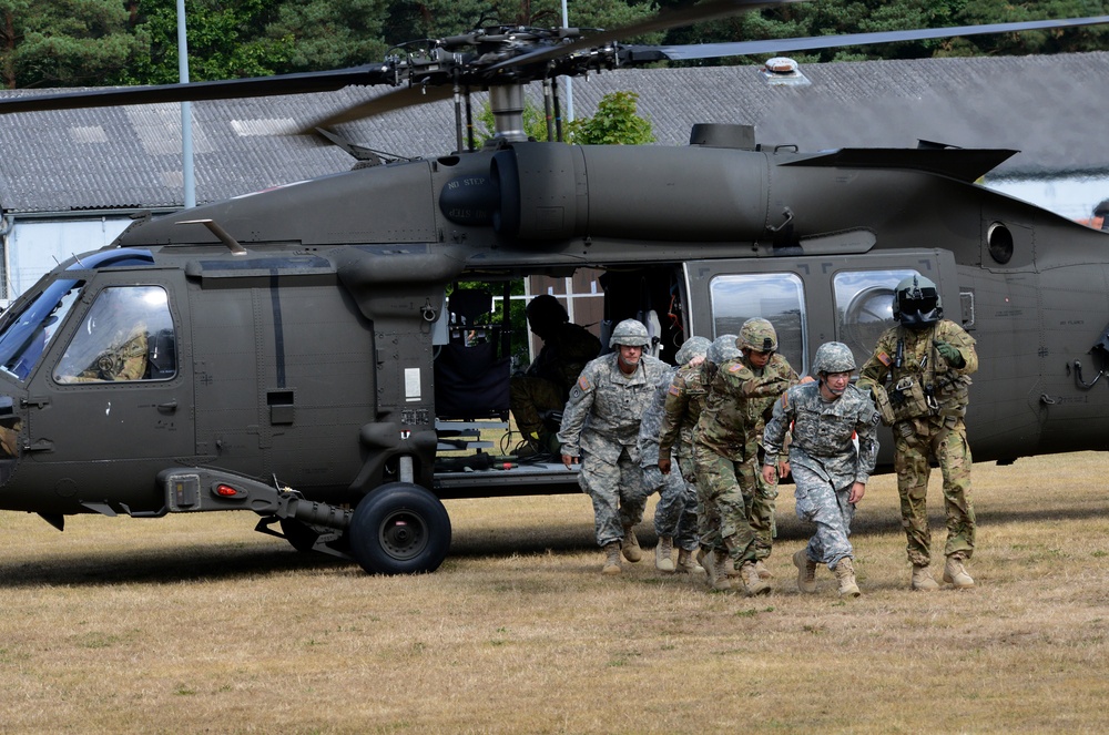 Army Reserve Medical Unit practices MEDEVAC with active duty Blackhawk