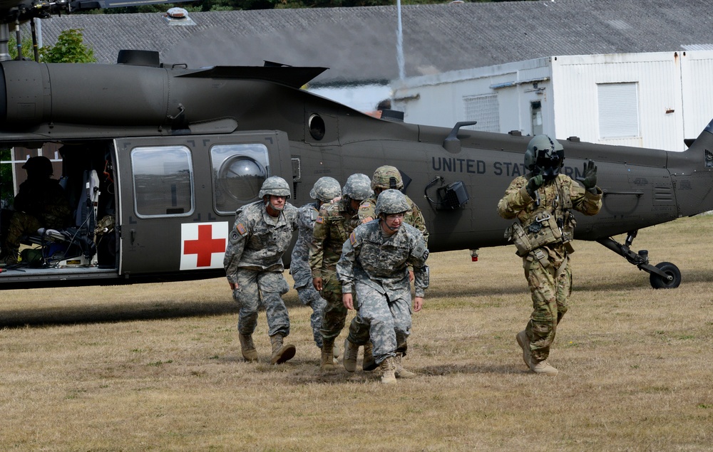 Army Reserve Medical Unit practices MEDEVAC with active duty Blackhawk