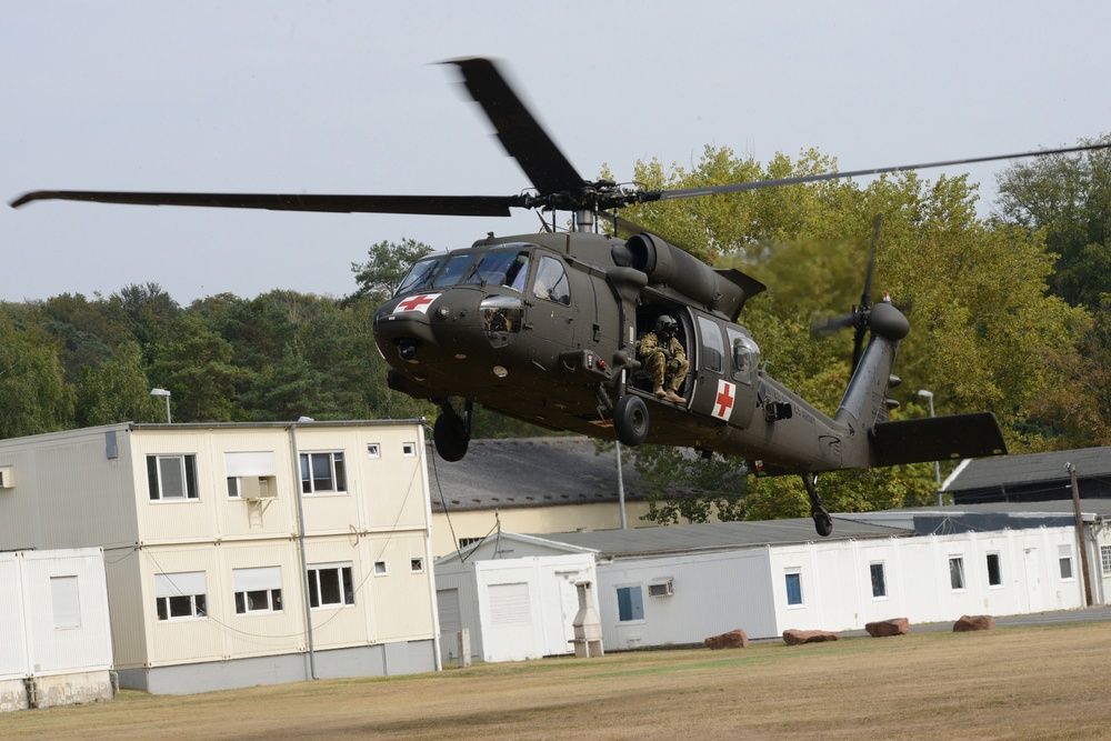 Army Reserve Medical Unit practices MEDEVAC with active duty Blackhawk