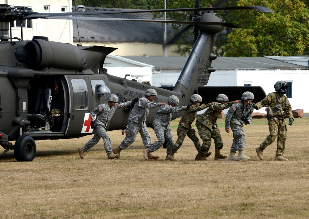 Army Reserve Medical Unit practices MEDEVAC with active duty Blackhawk