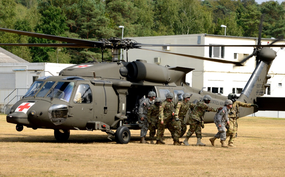 Army Reserve Medical Unit practices MEDEVAC with active duty Blackhawk