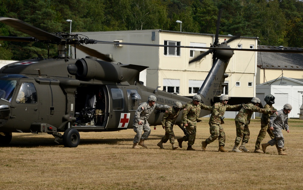 Army Reserve Medical Unit practices MEDEVAC with active duty Blackhawk