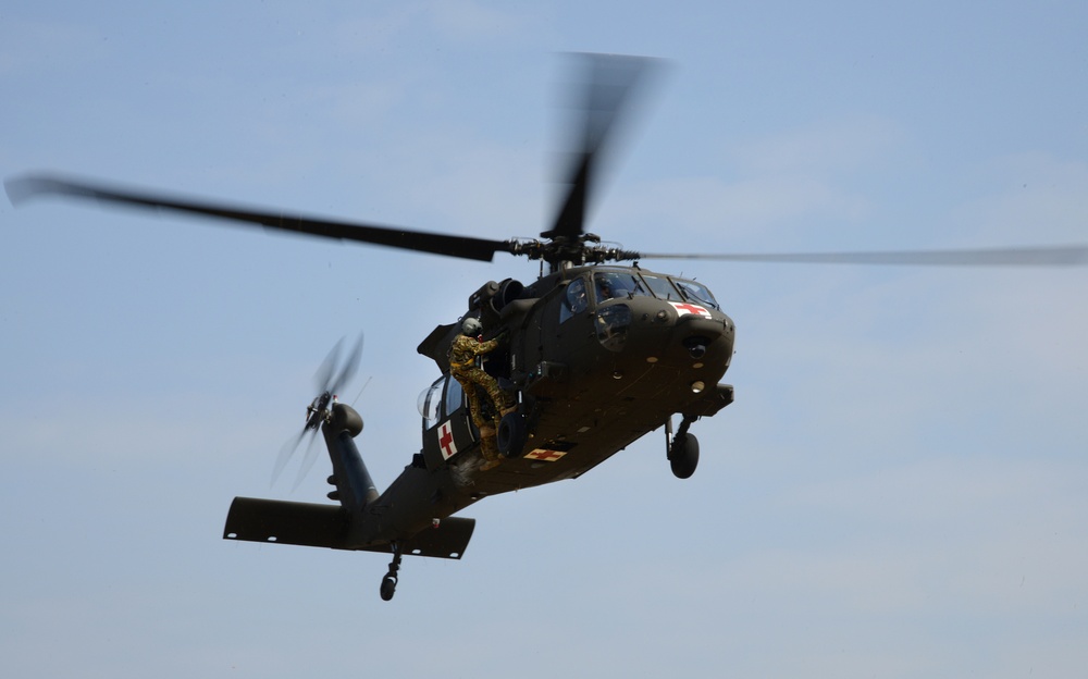 Army Reserve Medical Unit practices MEDEVAC with active duty Blackhawk