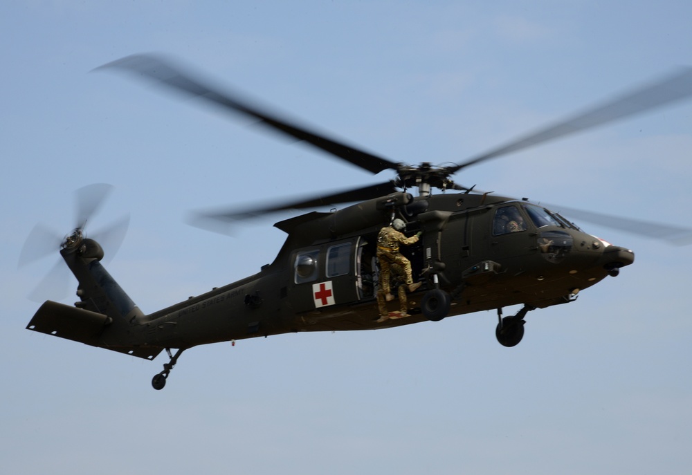 Army Reserve Medical Unit practices MEDEVAC with active duty Blackhawk