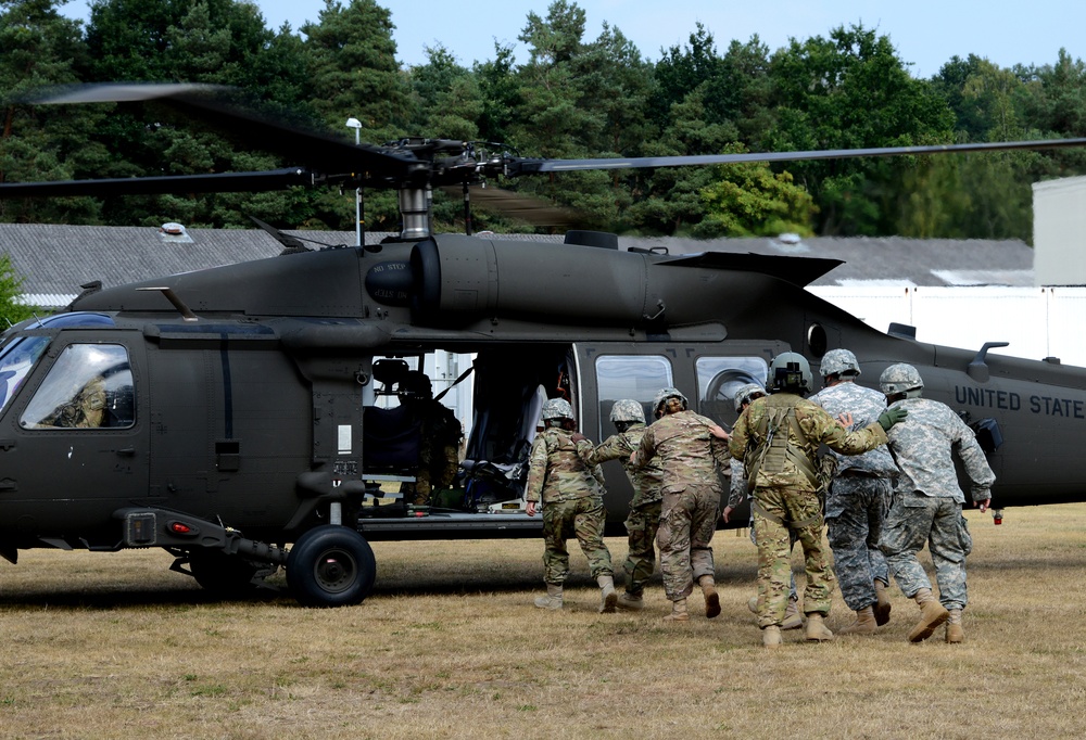 Army Reserve Medical Unit practices MEDEVAC with active duty Blackhawk