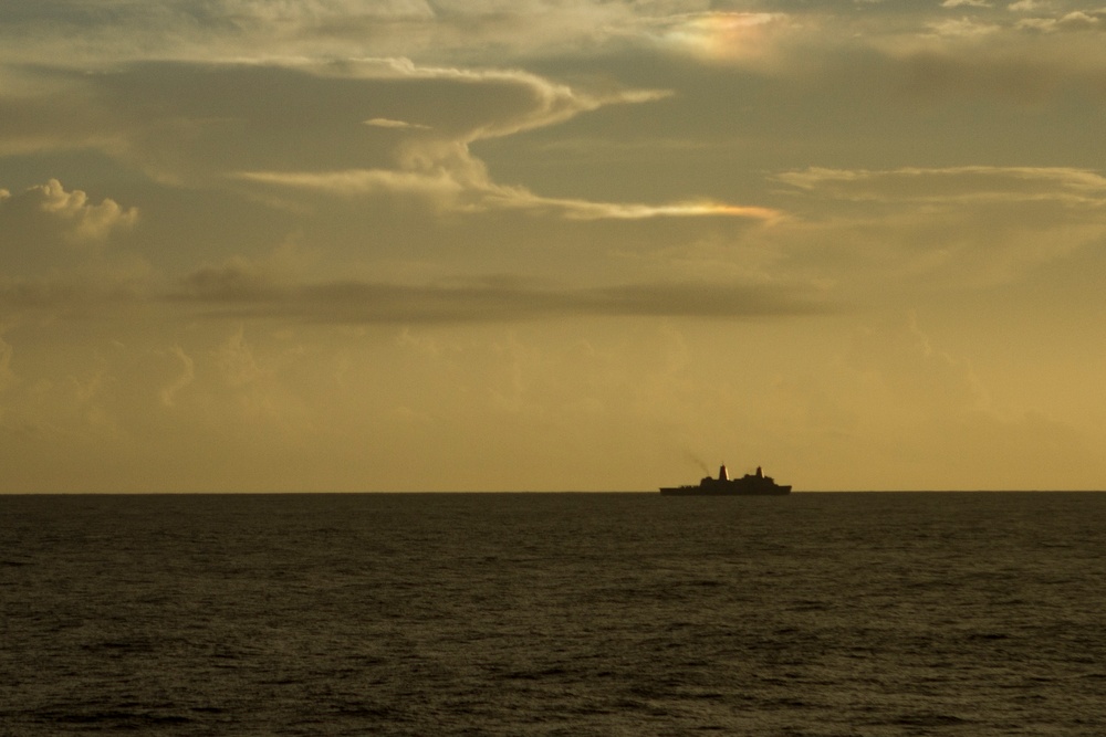 On the horizon, USS Green Bay (LPD 20) steams along