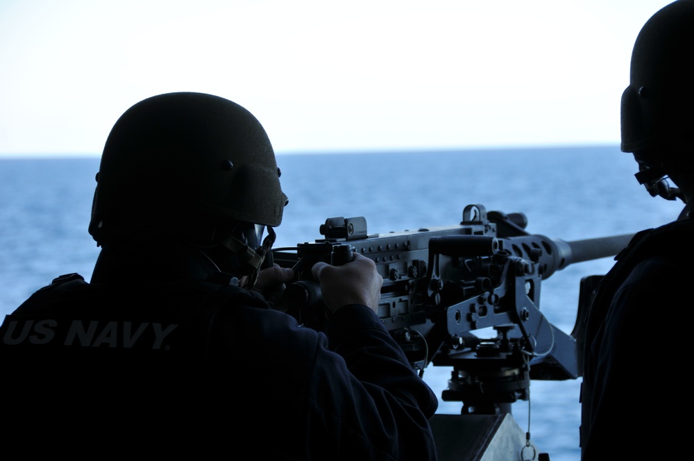 USS Zumwalt Sailors conduct crew served weapons firing exercise