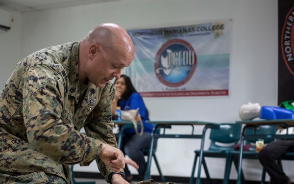 Valiant Shield 16: Tinian locals recieve combat lifesaving class from Marine Air Control Group 18