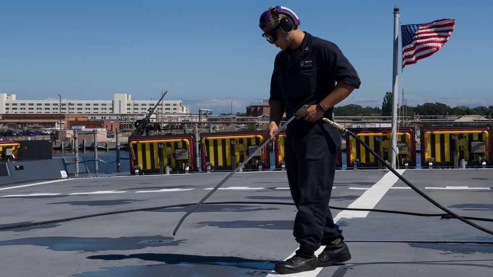 USS Zumwalt Sailor conducts maintenance