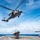 An MH-60S Sea Hawk helicopter conducts a vertical replenishment with USS Green Bay (LPD 20) during Exercise Valiant Shield 2016