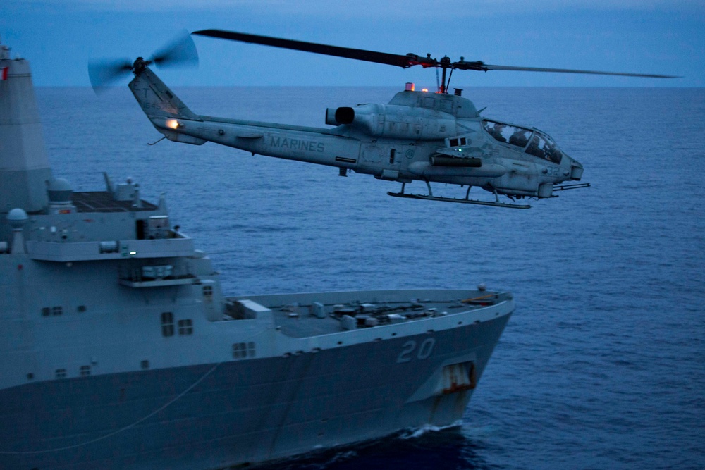 Super Cobra flies by USS Green Bay