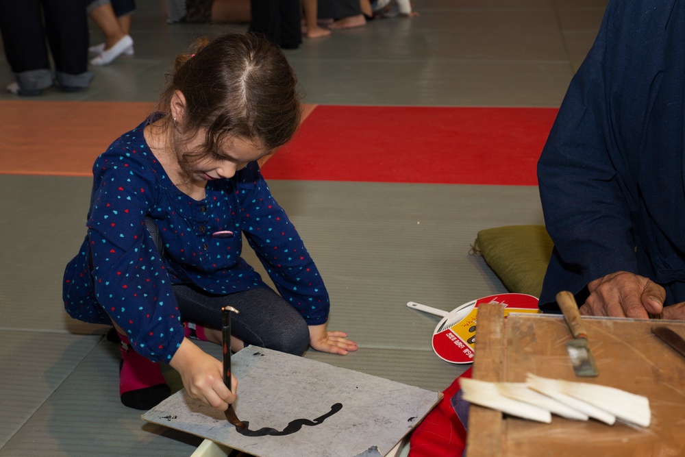 Air station residents experience Kumano Brush Festival