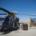 Maintainers unfold an HH-60