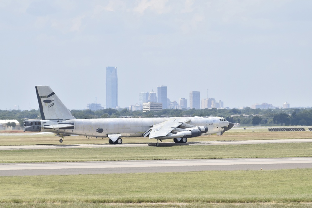 B-52H, 61-0007, 'Ghost Rider' taxis with the skyline of Oklahoma City visible in the background before an attempted functional test flight at Tinker AFB, Okla.