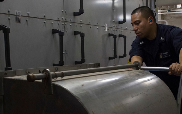 USS Zumwalt Sailor performs maintenance