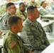Soldiers and Airmen listen to Army Reserve Command Sgt. Maj. James P. Wills
