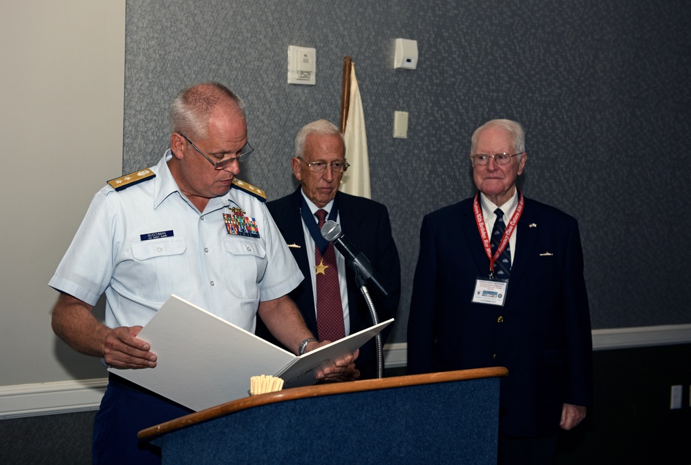 Rear Adm. Scott A. Buschman presents a Public Service Commendation to Retired Lt. William Verge on Sept. 29, 2016.