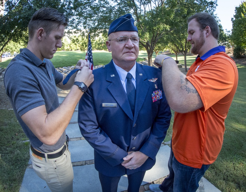 Mac Lain sons pin Lt Col rank on their dad