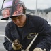 Sailor cleans fresh weld