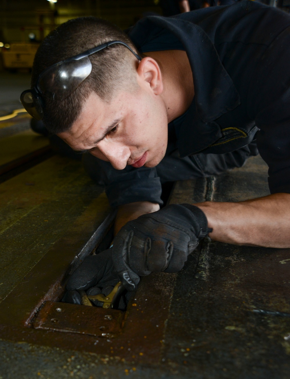 Sailor removes hangerbay door track