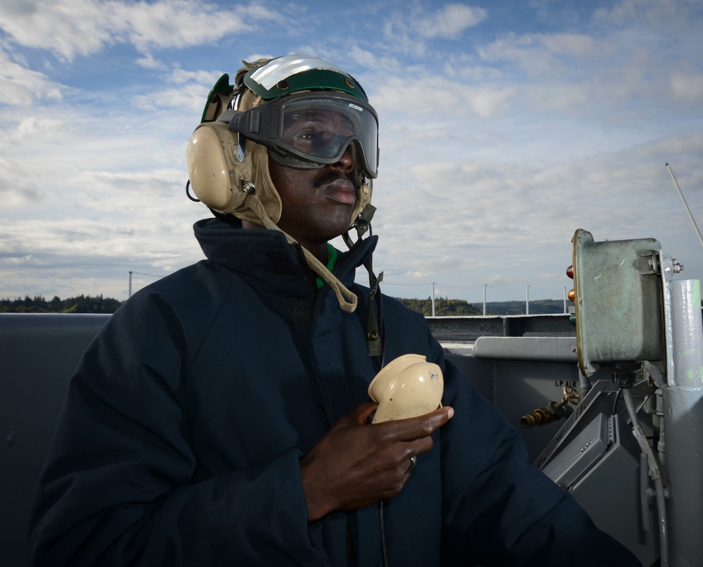 Sailor observes flight deck