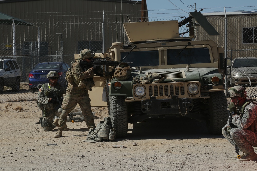 3rd Brigade Combat team, 1st Cavalry Division, return fire while under attack