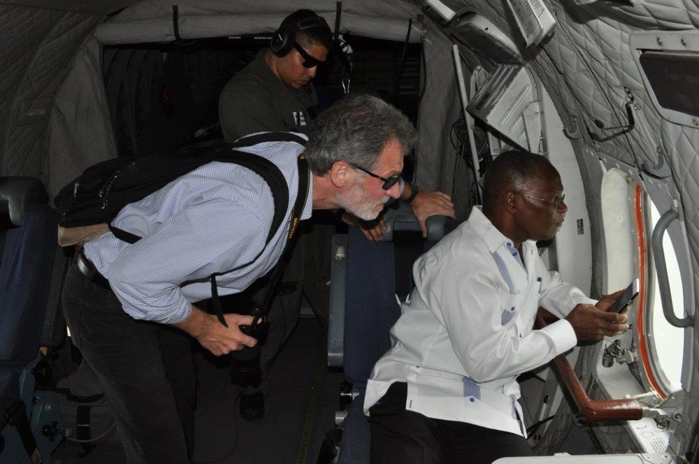 The president of Haiti and U.S. Ambassador to Haiti inspect damage to Haitian communities