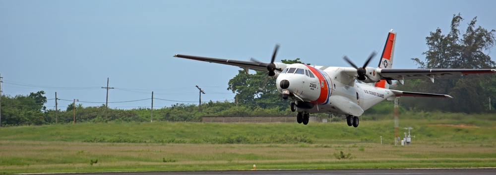 A Coast Guard Air Station Miami HC-144 Ocean Sentry airplane crew takes off from Air Station Borinquen in Puerto Rico for the first post-storm damage assessment flight over Haiti following Hurricane Matthew on October 5, 2016.