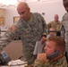 CAMP BLANDING, FL – Florida National Guard Soldiers 1st Sgt Timothy Smith, Capt. Kirk Strander and CW2 Joseph McKire discuss hurricane response at the Joint Operations Center during Hurricane Matthew.