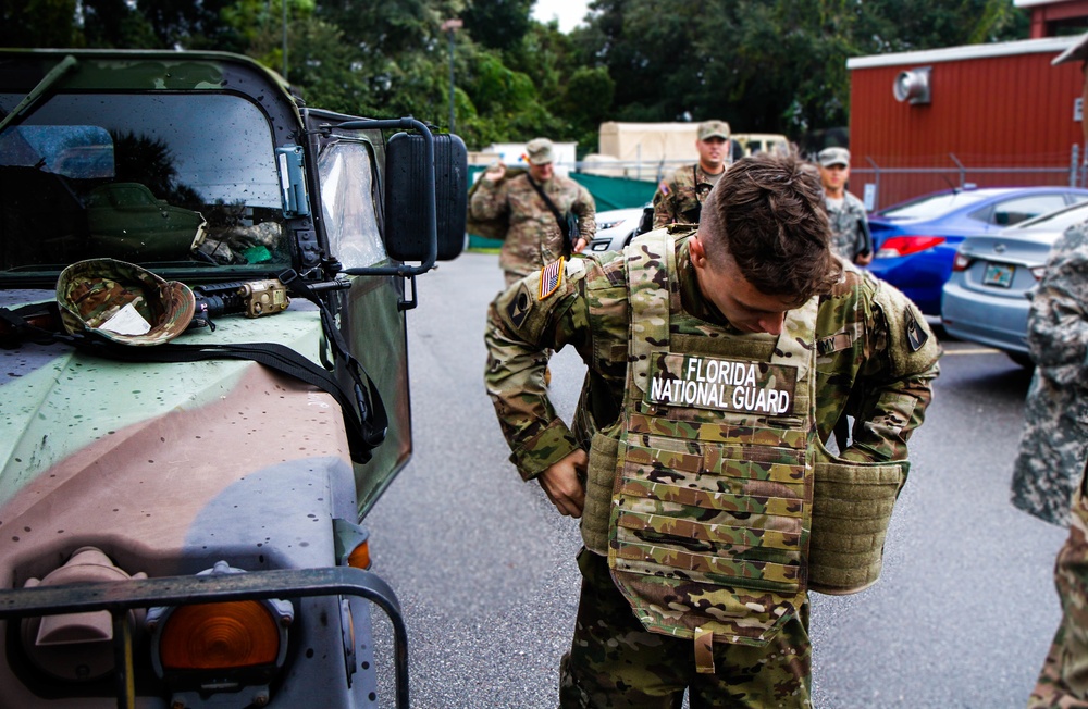 Soldier Dons Military Gear For Disaster Relief Efforts