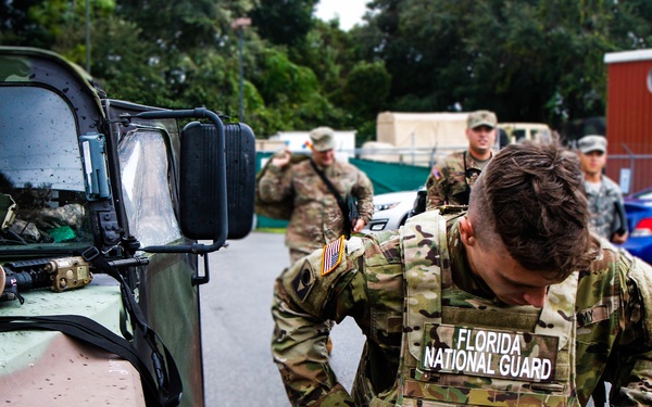 Soldier Dons Military Gear For Disaster Relief Efforts