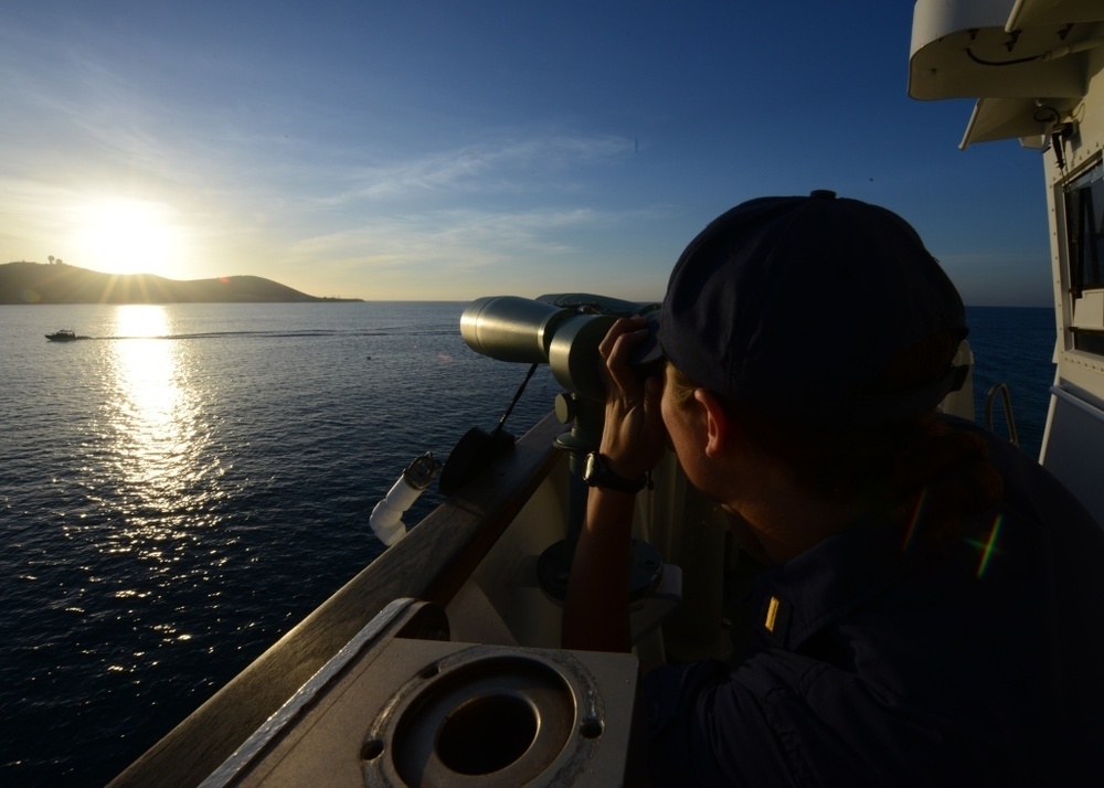 Coast Guard Cutter Spencer's electronics material officer verifies a visual fix during special sea detail while pulling into Guantanamo Bay, Cuba.