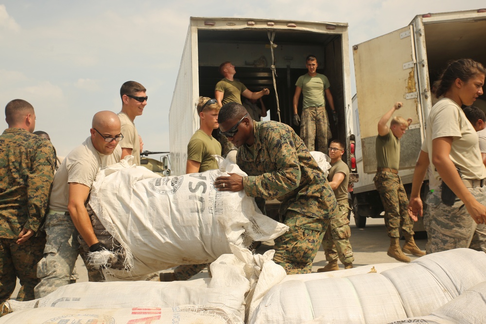 U.S. service members transport supplies to assist Hurricane Matthew victims