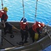 Sailors perform small boat operations