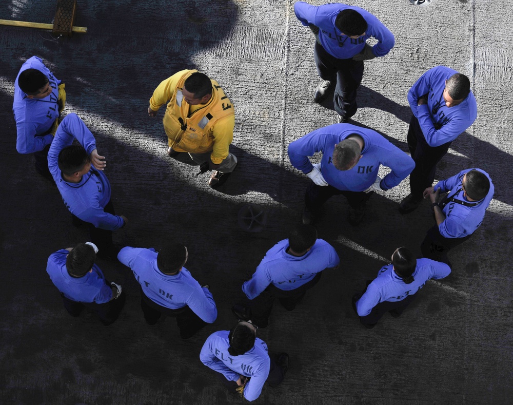 Nimitz Sailors test work on the flight deck