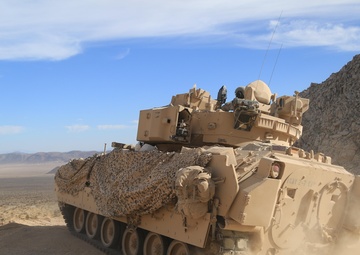 Soldiers navigate terrain at NTC