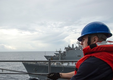USS Bonhomme Richard (LHD 6) conducts replenishment at sea