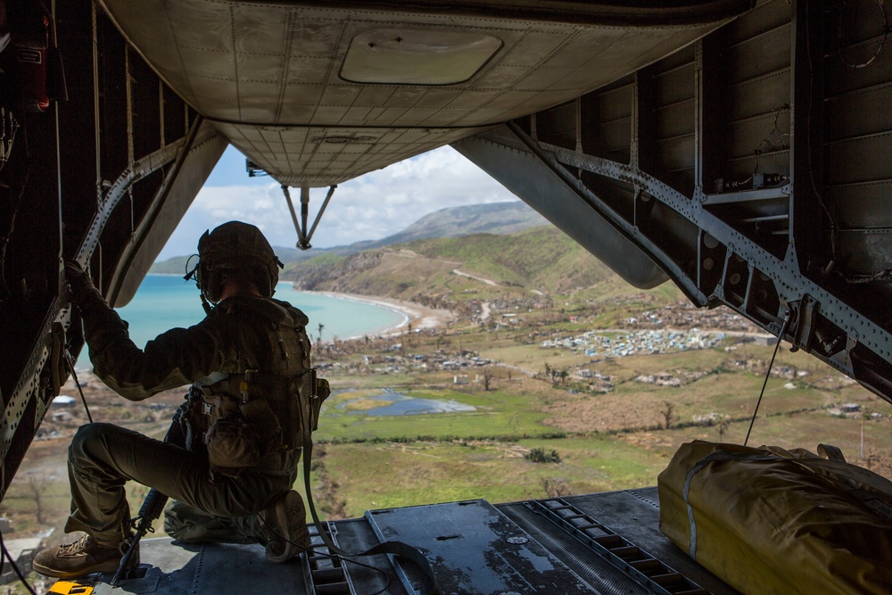 U.S. service members with Joint Task Force Matthew deliver food at Les Anglais, Haiti