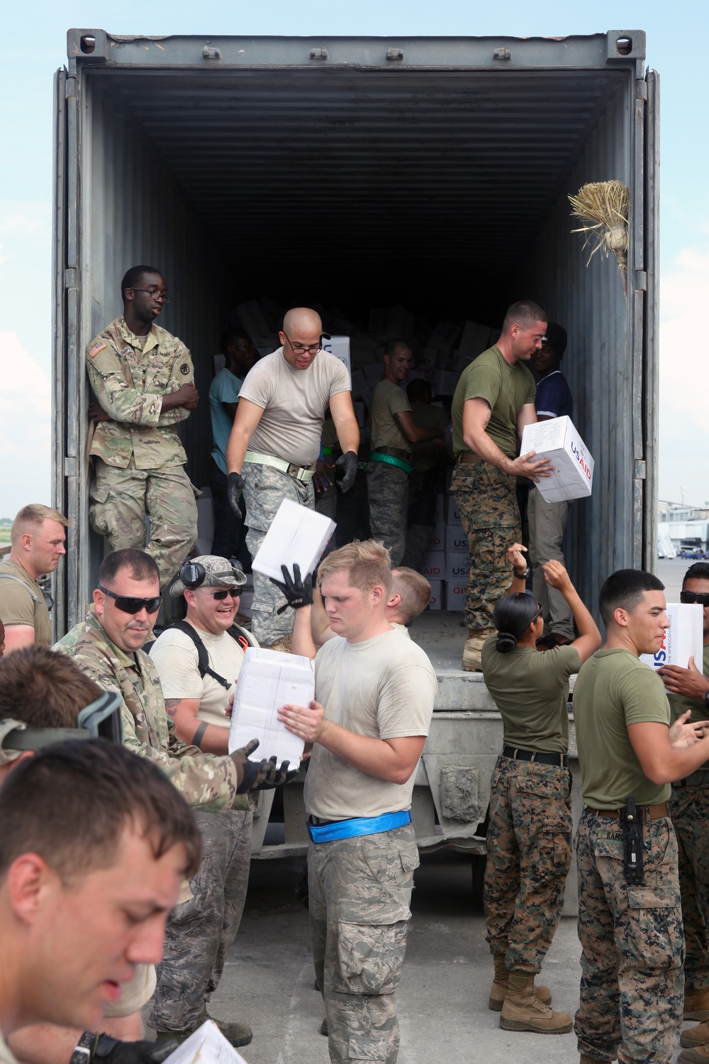 JTF Matthew servicemembers load USAID supplies in Haiti