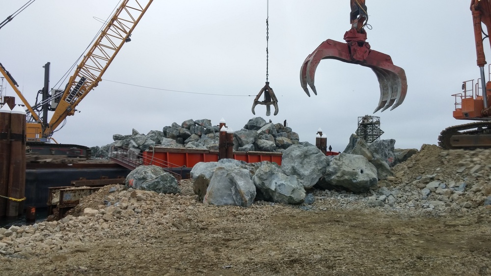 Boulders are offloaded for repairs to Jetty A.