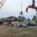 Boulders are offloaded for repairs to Jetty A.
