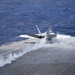 An F/A - 18E launches from USS Nimitz