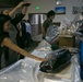 Marines on MCAS Futenma, Ginoza residents participate in tuna cutting party