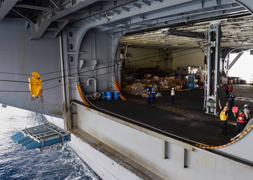 Nimitz conducts at-sea weapons onload