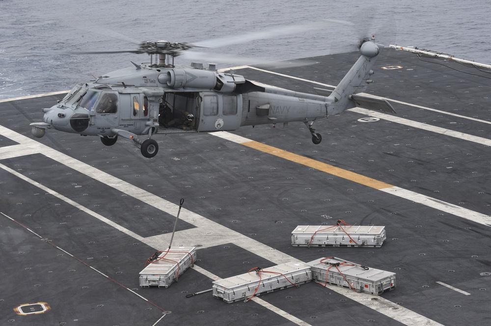 Sailors conduct at-sea ammunition onload