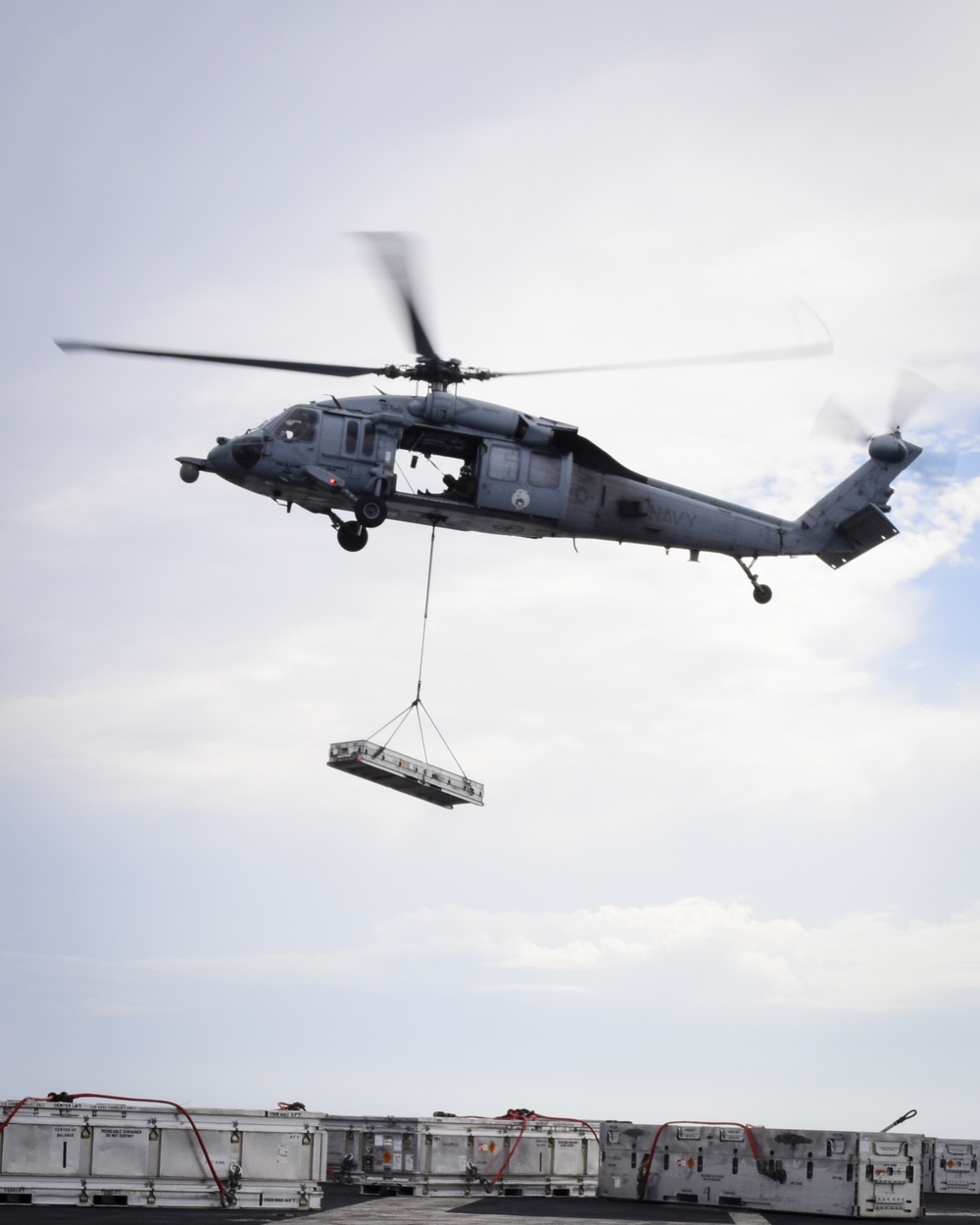 MH-60S transfers ordnance to flight deck of USS Nimitz